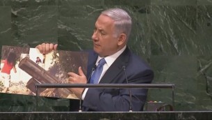 Prime Minister Benjamin Netanyahu shows photo of Hamas rocket launcher during speech to UN General Assembly (screen capture: UN, YouTube)