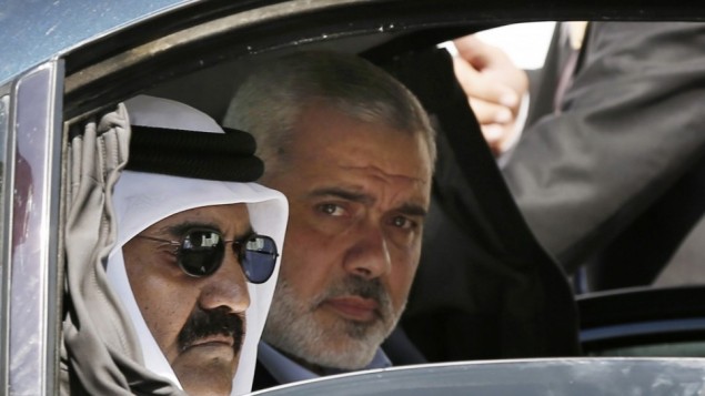 Qatari Emir Sheikh Hamad bin Khalifa al-Thani, left, and Gaza's Hamas prime minister Ismail Haniyeh, right, arrive for a cornerstone-laying ceremony for Hamad, a new residential neighborhood in Khan Younis, southern Gaza Strip, October 23, 2012 (: AP/Mohammed Salem) Qatari Emir Sheikh Hamad bin Khalifa al-Thani, left, and Gaza's Hamas prime minister Ismail Haniyeh, right, arrive for a cornerstone-laying ceremony for Hamad, a new residential neighborhood in Khan Younis, southern Gaza Strip, October 23, 2012 (: AP/Mohammed Salem)