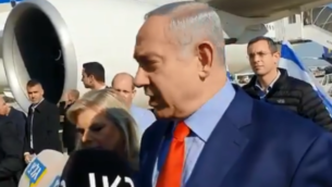 رئيس الوزراء بنيامين نتنياهو يتحدث للصحافيين في مطار بن غوريون قبل إقلاع طائرته إلى واشنطن، 26 يناير، 2019. (Screen capture: Twitter)
