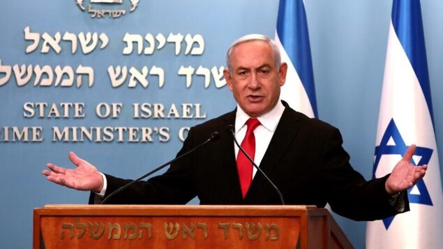 رئيس الوزراء بنيامين نتنياهو يلقي كلمة في مكتبه في القدس، 14 مارس 2020 (GALI TIBBON / POOL / AFP)