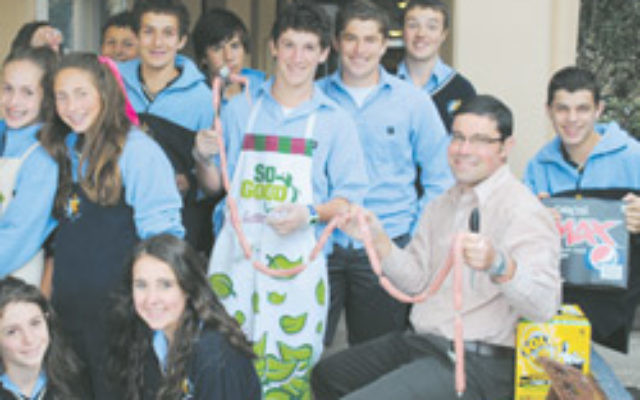 Mount Scopus teacher Braham Morris with year 9 students who will travel to Cambodia. Mount Scopus teacher Braham Morris with year 9 students who will travel to Cambodia.