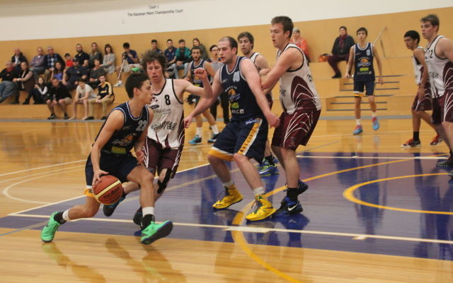 Maccabi’s Jon Polonsky drives to the ring.