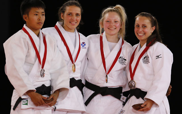 Amy Meyer (right) pictured with fellow judo medal-winners in the women’s under-48kg category in Glasgow, Scotland.
Photo: AP Photo/Frank Augstein Amy Meyer (right) pictured with fellow judo medal-winners in the women’s under-48kg category in Glasgow, Scotland.
Photo: AP Photo/Frank Augstein