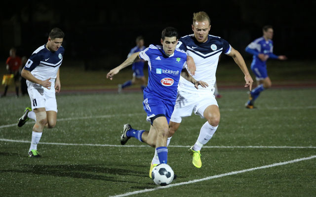 Hakoah’s Jarrod Basger manoeuvres past Palm Beach captain Justyn McKay in their FFA Cup round of 32 clash. Photo: Noel Kessel