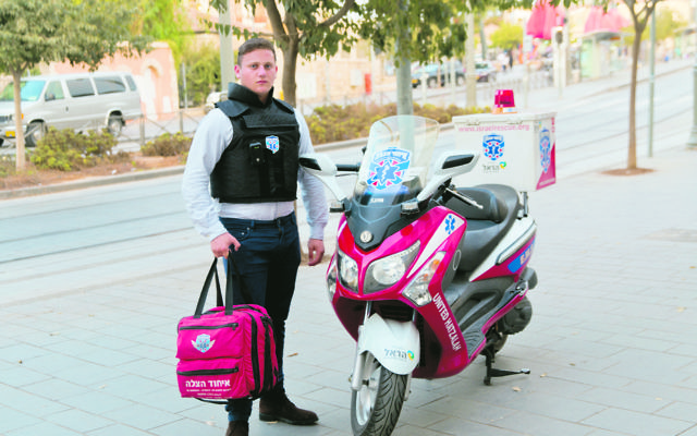 Australian Dovi Meyer, who is on the scene of terrorist attacks as a volunteer for Hatzolah, is pictured in an eerily quiet Yaffo Street in Jerusalem.