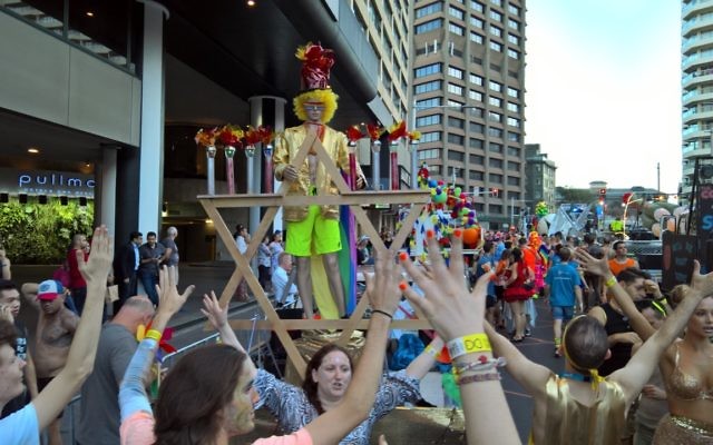 Dayenu members and supporters practise their parade choreography in front of the Dayenu float. Photo: Toby Evans (Toby Centre Photography). Dayenu members and supporters practise their parade choreography in front of the Dayenu float. Photo: Toby Evans (Toby Centre Photography).