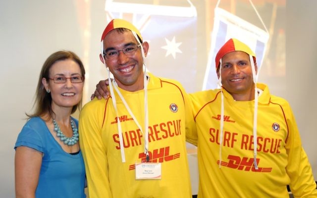 Gabrielle Upton with surf life savers Royi Levi and Barak Davidovits. Photo: Noel Kessel