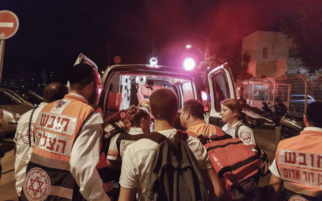 Megan Bernitz (right) helping a patient into an ambulance after last week’s terrorist attack in Tel Aviv. Photo: Moti Karelitz/Flash90.