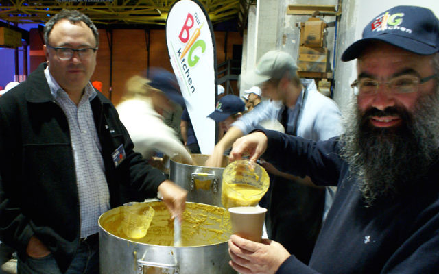 Our Big Kitchen’s general manager Russel Levert and executive director Rabbi Dovid Slavin serving soup at Carriageworks in Sydney on June 23 for the Vinnies CEO Sleepout. Photo: Shane Desiatnik. Our Big Kitchen’s general manager Russel Levert and executive director Rabbi Dovid Slavin serving soup at Carriageworks in Sydney on June 23 for the Vinnies CEO Sleepout. Photo: Shane Desiatnik.