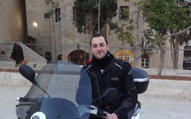 Paramedic and first responder Aharon Adler with the medicycle donated MDA.