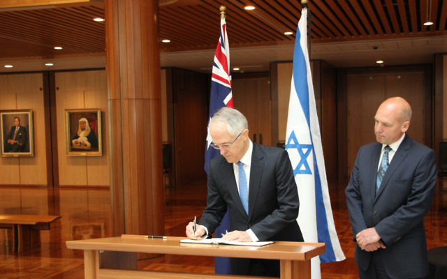 Prime Minister Malcolm Turnbull signs a condolence book in Canberra in honour of Shimon Peres. Pictured next to him is president of the Senate, Stephen Parry. Prime Minister Malcolm Turnbull signs a condolence book in Canberra in honour of Shimon Peres. Pictured next to him is president of the Senate, Stephen Parry.