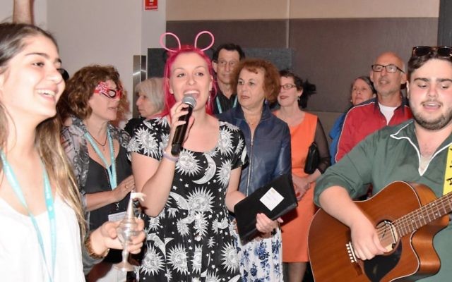 From left: Rose Polack of Netzer, Shannyn Gelbart of King David School and Joel McCarroll of Netzer lead Havdalah in fancy dress. Photo: Brian Samuel