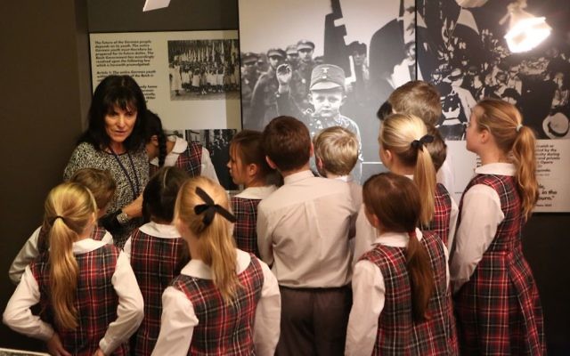 Sydney Jewish Museum volunteer Melanie Forer guiding visiting students.