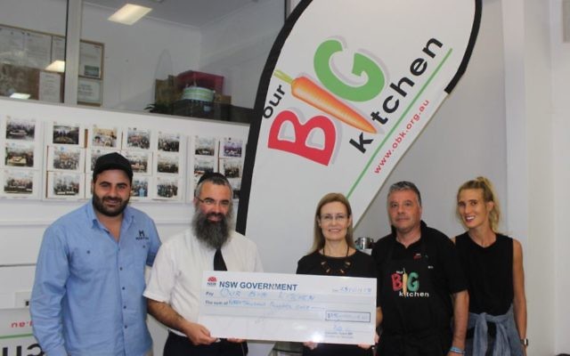 From left: Gabrielle Upton (centre) presenting the $15,000 to OBK's Charlie Rabie, Rabbi Dr Dovid Slavin, George Karounis and Shannon Cohen.