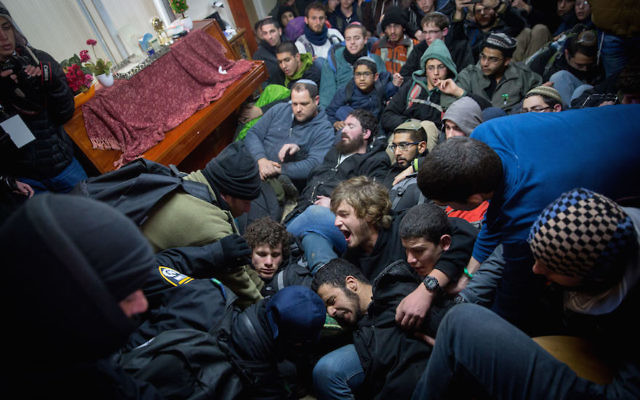 Israeli settlers scuffling with security forces during the evacuation of Amona.  Photo: Miriam Alster/Flash90/JTA