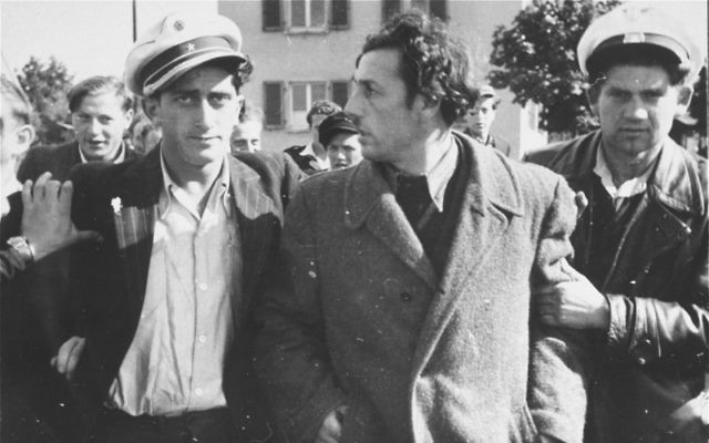 Jewish police detain a former Kapo who was recognised in the street at the Zeilsheim displaced persons’ camp in Germany. (US Holocaust Memorial Museum, courtesy of Alice Lev) Jewish police detain a former Kapo who was recognised in the street at the Zeilsheim displaced persons’ camp in Germany. (US Holocaust Memorial Museum, courtesy of Alice Lev)