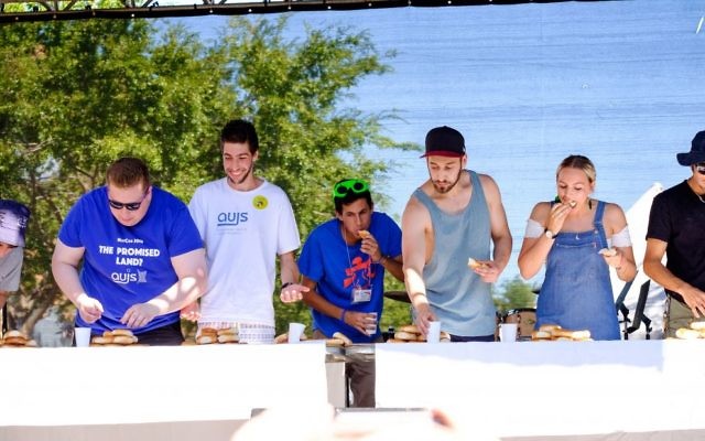 Contestants at the 2017 In One Voice bagel eating competition. Photo: Ren Rizzolo Contestants at the 2017 In One Voice bagel eating competition. Photo: Ren Rizzolo