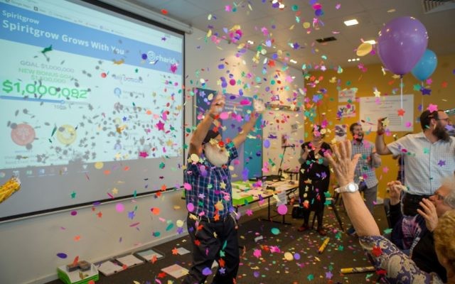 Rabbi Laibl Wolf celebrates as the campaign breaks the $1 million barrier.
