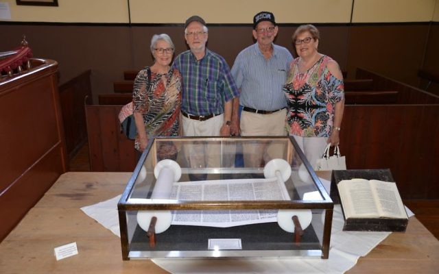 From left: Devorah and Dr Ronald Zmood together with Ben-Zion and Barbara Erez by their handcrafted Torah replica at Broken Hill.