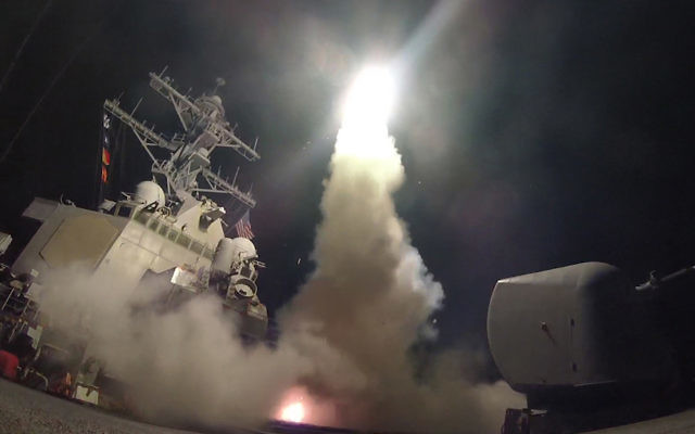 The USS Porter firing a Tomahawk missile at a Syrian military airfield last Friday.
Photo: Ford Williams/US. Navy via Getty Images/JTA The USS Porter firing a Tomahawk missile at a Syrian military airfield last Friday.
Photo: Ford Williams/US. Navy via Getty Images/JTA