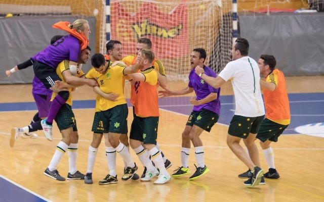 The Australian futsal team celebrating their last-minute victory over Brazil. Photo: Julie Kerbel The Australian futsal team celebrating their last-minute victory over Brazil. Photo: Julie Kerbel