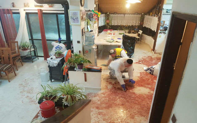 Volunteers from the ZAKA search and rescue organisation remove blood from the scene of last Friday's terror attack. Photo: ZAKA.
