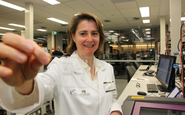 Dr Dorit Samocha-Bonet holding a micro-fluid chip inside the Garvan-Weizmann Centre for Cellular Genomics. Photo: Shane Desiatnik Dr Dorit Samocha-Bonet holding a micro-fluid chip inside the Garvan-Weizmann Centre for Cellular Genomics. Photo: Shane Desiatnik