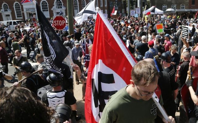 A white supremacist at the rally in Charlottesville. Photo: AP Photo/Steve Helber.