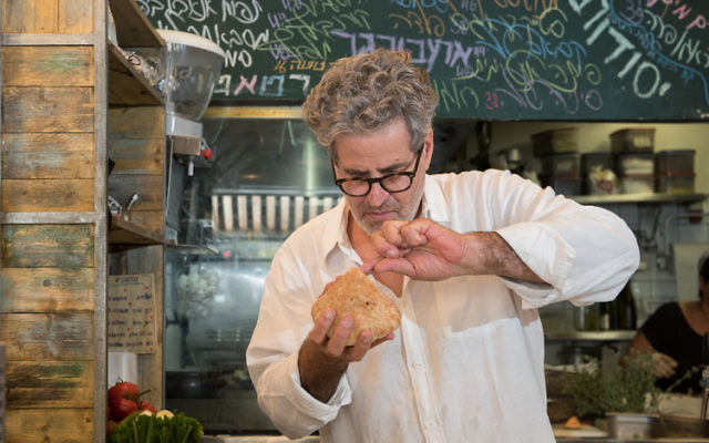 Eyal Shani preparing one of his famous dishes.