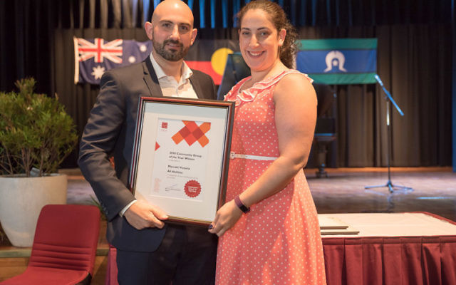 Glen Eira mayor Tony Athanasopoulos (left) presents Shari Cohen with the award.