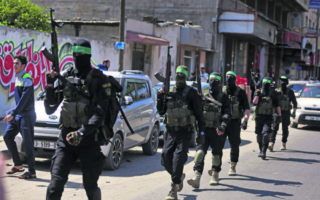 Masked militants from Hamas's Izzedine al-Qassam Brigades during Sunday's drill in Gaza. Photo: AP Photo/Khalil Hamra