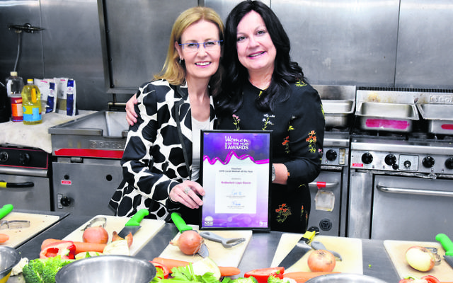State Minister and local member for Vaucluse Gabrielle Upton presents Laya Slavin with Vaucluse Woman Of The Year Award. Photo: Noel Kessel