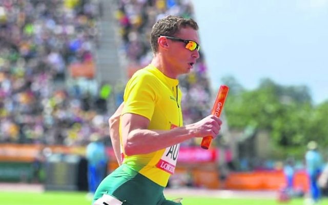 Steven Solomon running in heat 2 of the men's 4x400m relay at the Commonwealth Games. Photo: AAP