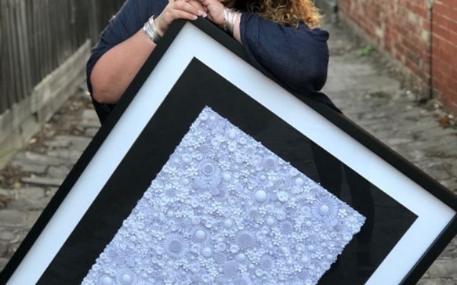 Justine Kuran with one of her latest quilling works.