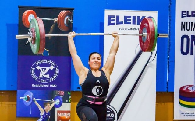 Leora Yates raises the bar at the 2018 Victorian Weightlifting Championships in early July. She will go to Barcelona next month to compete at the 2018 IWF Masters Weightlifting World Championships. Photo: Black Rose Australia