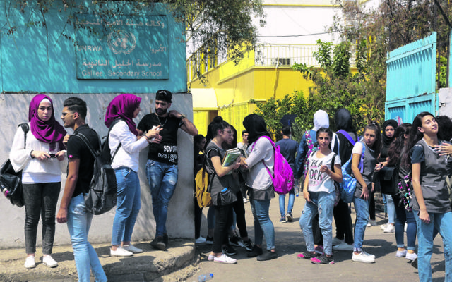 Palestinian students outside a UNRWA school in Beirut. Photo: EPA/Nabil Mounzer Palestinian students outside a UNRWA school in Beirut. Photo: EPA/Nabil Mounzer
