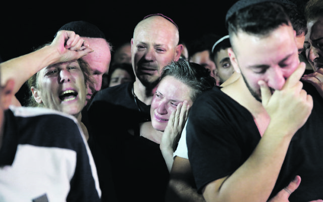 Family members at the funeral of Kim Levengrond-Yehezkel. Photo: AP Photo/Ariel Schalit