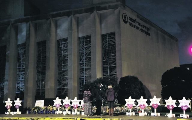 Stars of David with the names of those killed stand in front of the Tree of Life Synagogue. Photo: AP Photo/Matt Rourke