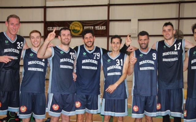 Time to celebrate: Maccabi Lakers players (from left) Ben Knight, Zach Ehrenfeld, Keyan Kramer, Josh Cohen, Marcel Ninio, Greg Shapiro, Anatoly Bose and Indiana Faithfull. Photo: Shane Desiatnik