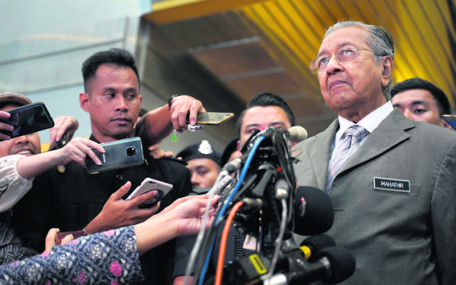 Malaysia's Prime Minister Mahathir Mohamad faces the media on Monday. Photo: AP Photo/Yam G-Jun