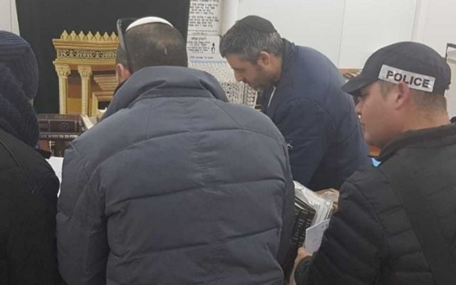 Police enter the study hall of the Pri Haaretz Yeshivah high school in the West Bank settlement of Rehelim on January 9. Photo: Honenu/Elishuv Har-Shalom