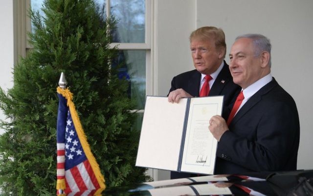 Prime Minister Benjamin Netanyahu and US President Donald Trump hold up the signed document acknowledging Israeli sovereignty over the Golan Heights. Photo: Twitter Prime Minister Benjamin Netanyahu and US President Donald Trump hold up the signed document acknowledging Israeli sovereignty over the Golan Heights. Photo: Twitter