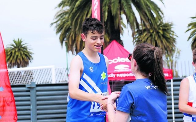 Ori Drabkin collecting one of his three gold medals at the Victorian T&F Championships. Photo: Peter Haskin Ori Drabkin collecting one of his three gold medals at the Victorian T&F Championships. Photo: Peter Haskin