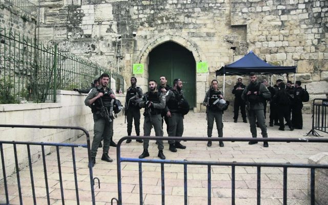 Israeli border police block the entrance to al-Aqsa compound in Jerusalem last Tuesday after Palestinian suspects threw a firebomb at a police station. Photo: AP Photo/Mahmoud Illean Israeli border police block the entrance to al-Aqsa compound in Jerusalem last Tuesday after Palestinian suspects threw a firebomb at a police station. Photo: AP Photo/Mahmoud Illean