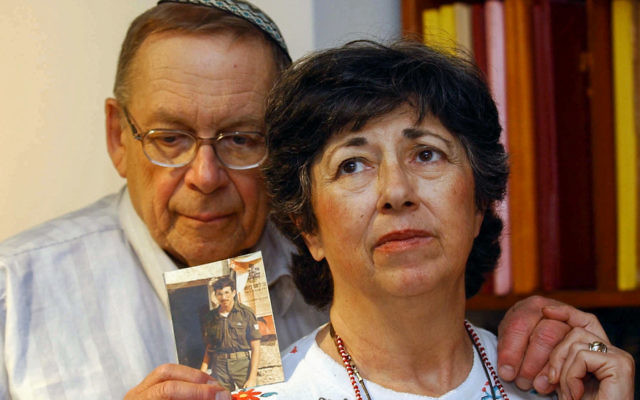 Miriam and Yonah Baumel hold a picture of their son Zachary Baumel, who was taken prisoner of war in 1982, in Jerusalem on July 07, 2003. Photo: FLASH90 Miriam and Yonah Baumel hold a picture of their son Zachary Baumel, who was taken prisoner of war in 1982, in Jerusalem on July 07, 2003. Photo: FLASH90