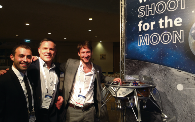 David Shteinman (centre) with mission analysts Adam Michaels and Adam
Greene and a mock-up of Beresheet. David Shteinman (centre) with mission analysts Adam Michaels and Adam
Greene and a mock-up of Beresheet.