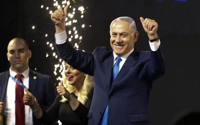 Israel's Prime Minister Benjamin Netanyahu waves to his supporters after polls for Israel's general elections closed in Tel Aviv, Israel, Wednesday, April 10, 2019. (AP Photo/Ariel Schalit)