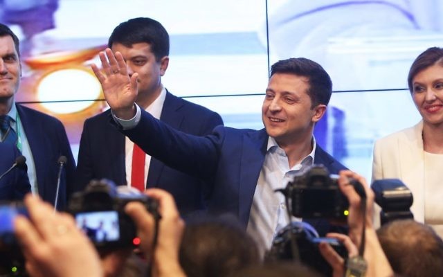 Volodymyr Zelensky, second from right, waves to supporters at his campaign headquarters in Kiev, Ukraine, April 21, 2019. He won the country’s presidential election with over 70 percent of the vote. (Xinhua/Sergey/Getty Images)
