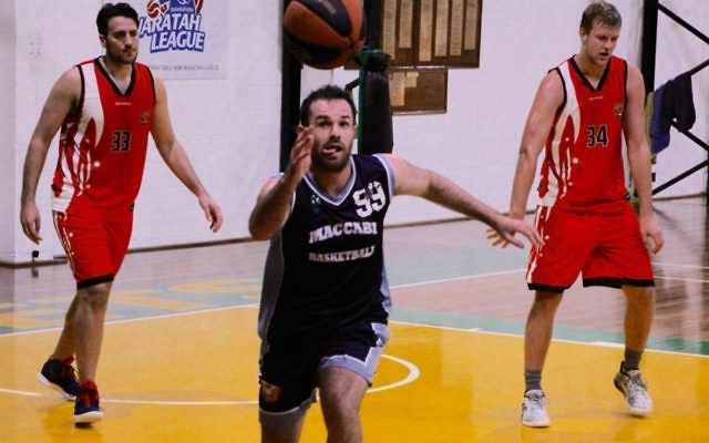 Maccabi Lakers’ Keyan Kramer regains possession in the team’s grand final
win against the Inner City Raptors. Photo: Shane Desiatnik
