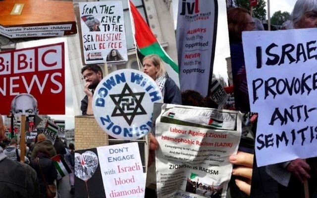 Signs carried and badges worn at the National Demonstration for Palestine in central London on May 11, 2019.
